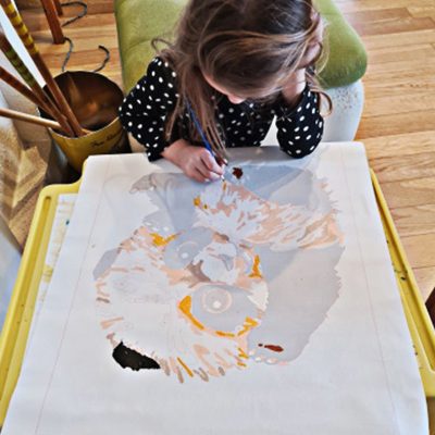 A child painting by numbers